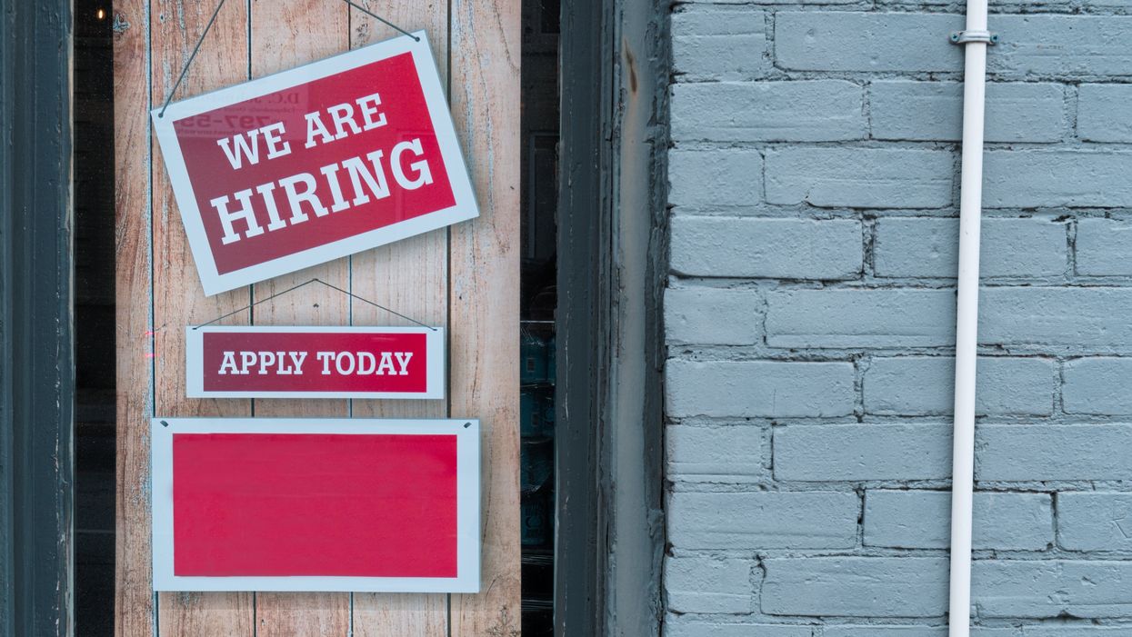 a sign that says we are hiring and apply today
