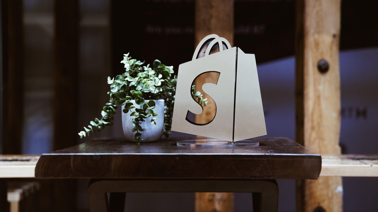 a shopify bag logo on a desk