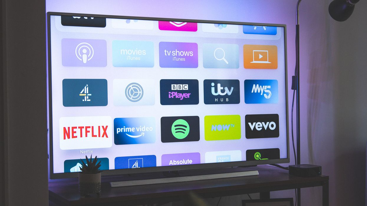 a TV with icons from Netflix and more apps.