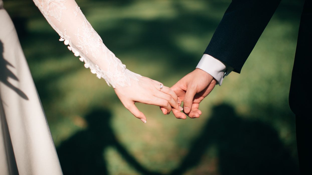 man and woman holding hands focus photo