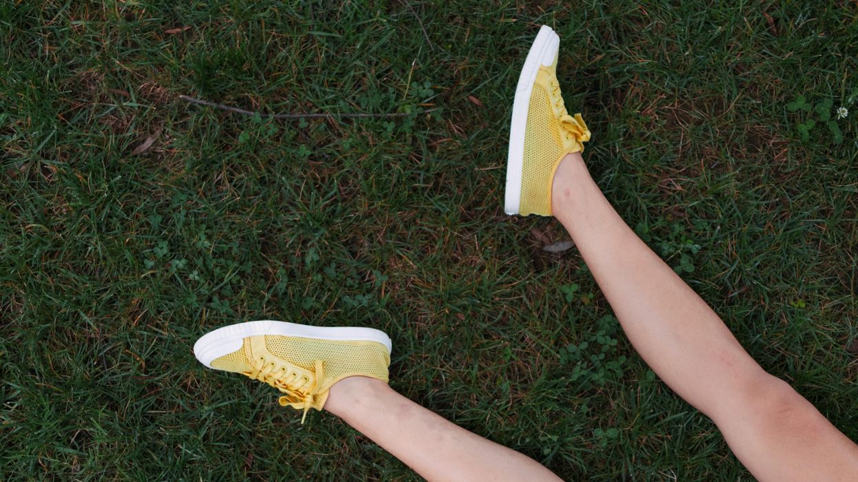 yellow-and-white low-top sneakers